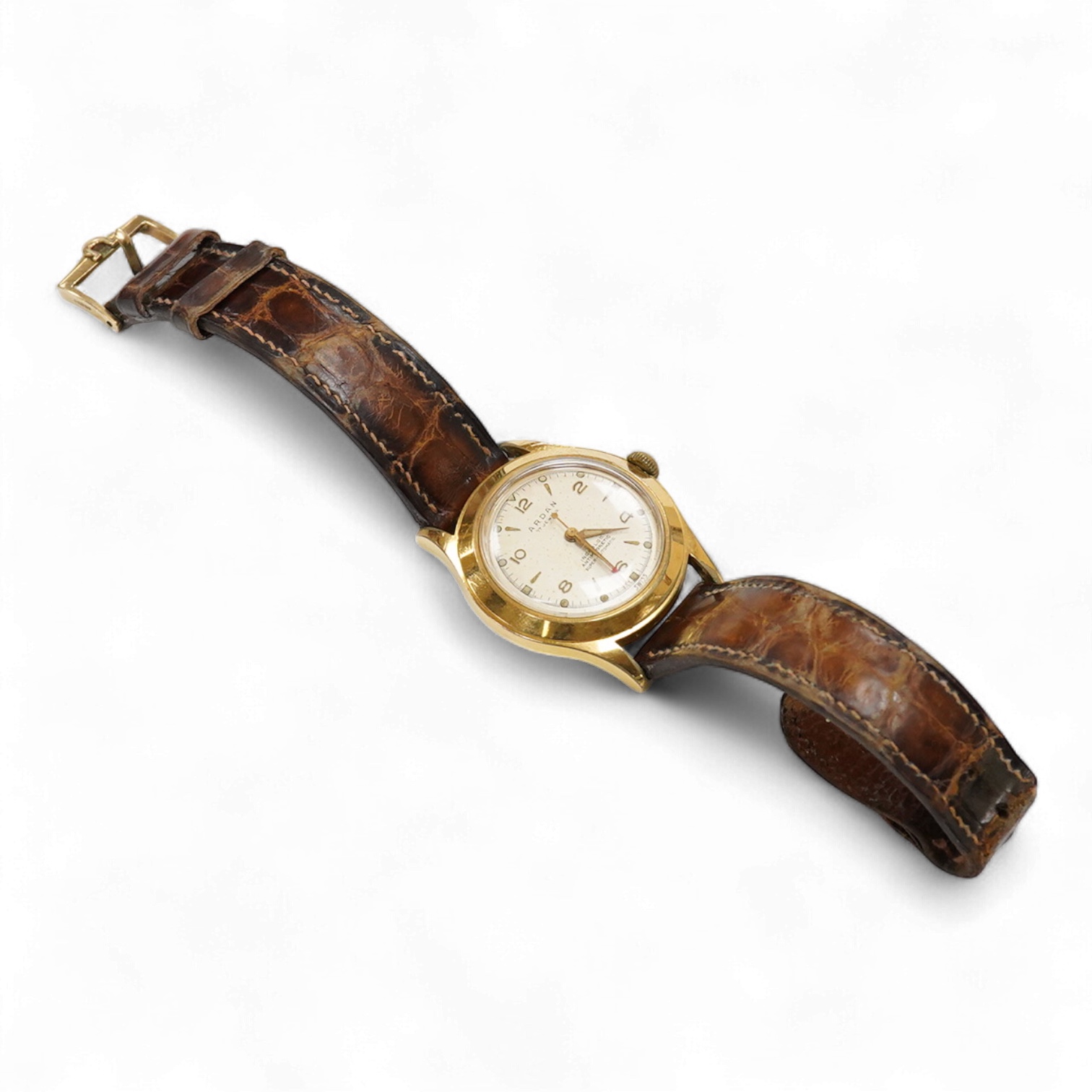 A gentleman's mid 20th century steel and gold plated Arden 'Super Automatic' wrist watch, with baton and Arabic numerals and seep seconds with red arrow pointer, case diameter 33mm, on an Omega brown leather strap.